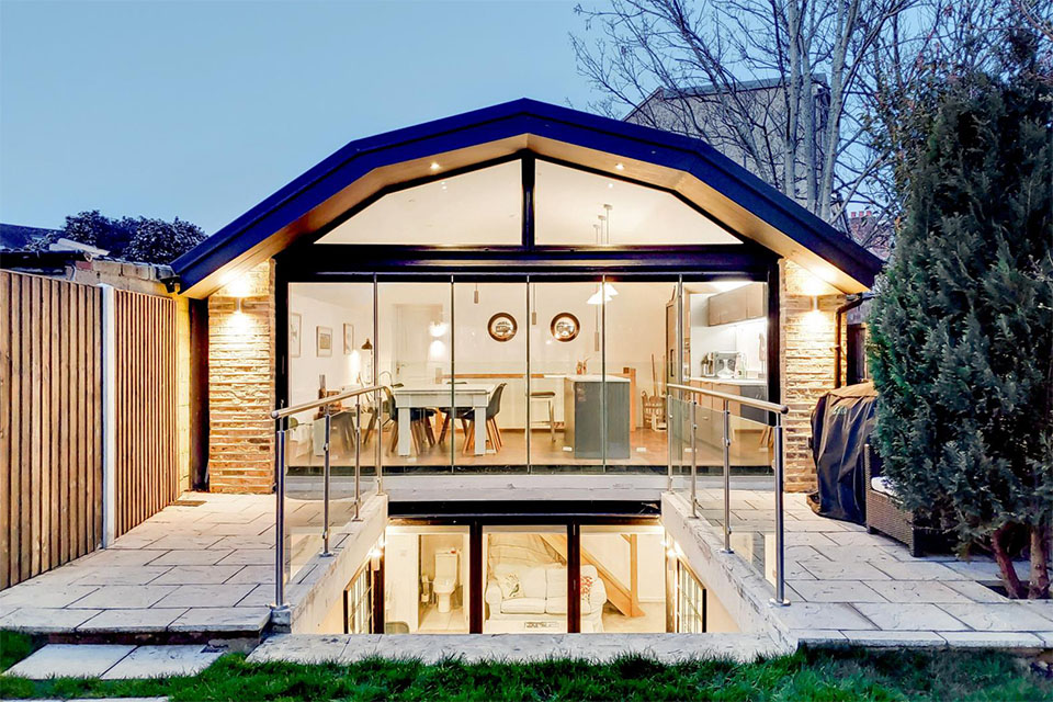 Front elevation of a garden office building with a basement.