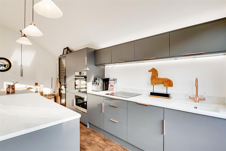 A newly built garden building showing a newly installed kitchen area.