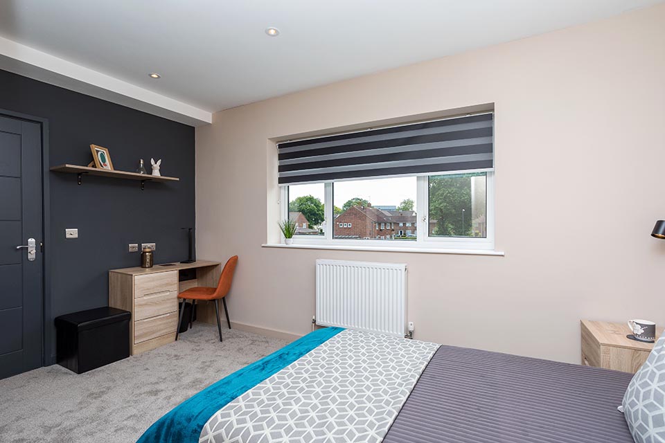 Recently decorated bedroom of a house with a newly designed layout.