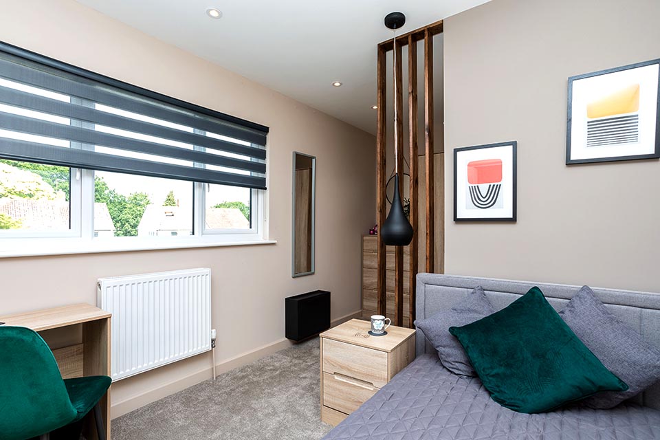 Recently decorated bedroom of a house with a newly designed layout.