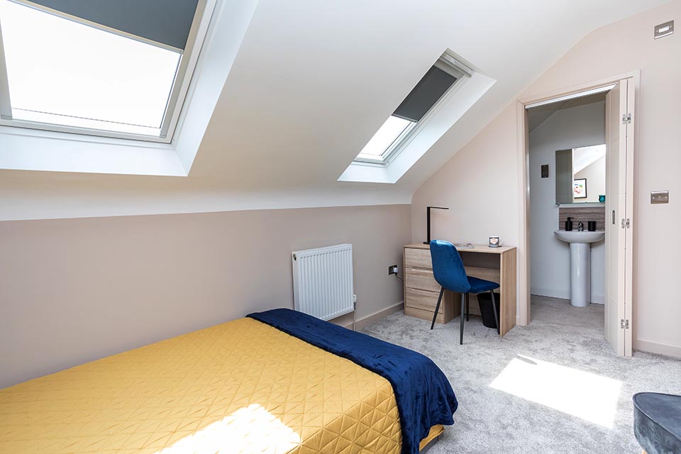 Recently decorated loft conversion bedroom of a house with a newly designed layout.