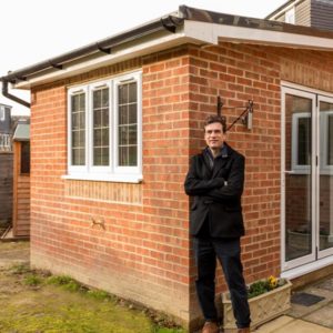 Horsham architect, Luigi Del Vecchio, leaning against a recently completed rear extension project.