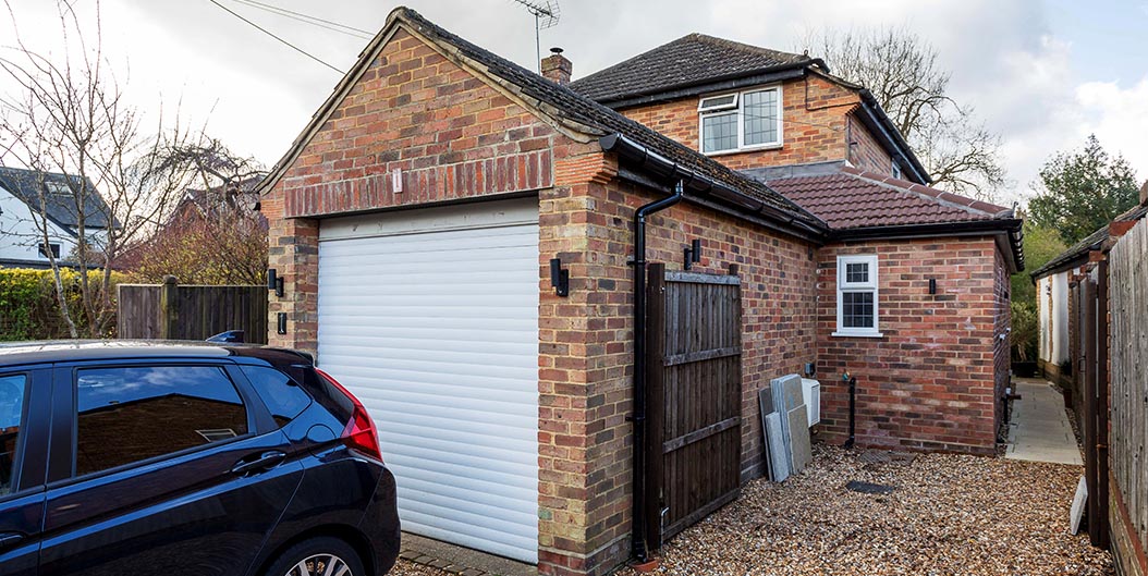 Rear view of a detatched house with a newly built side extension.