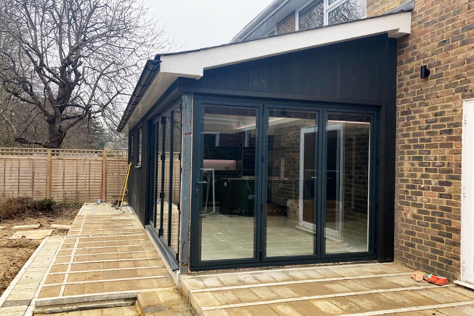 A rear extension with wide floor to ceiling folding doors.