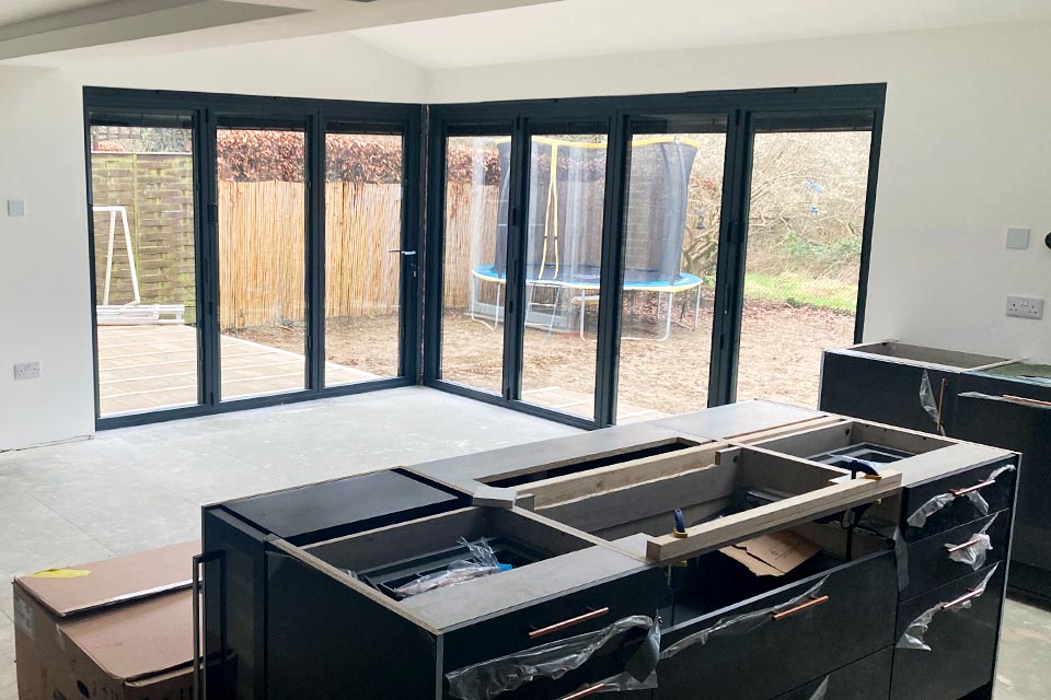 Interior shot of large folding doors on a newly built rear extension.